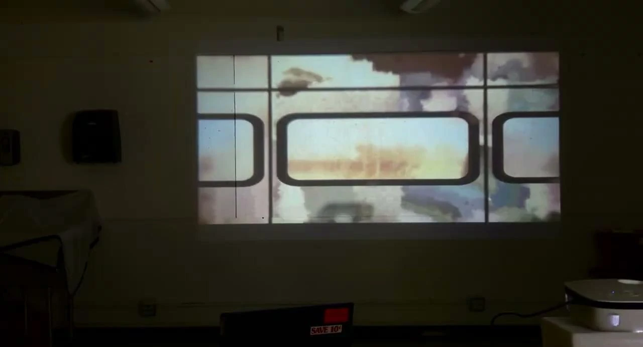 Train footage projected across the walls of an installation